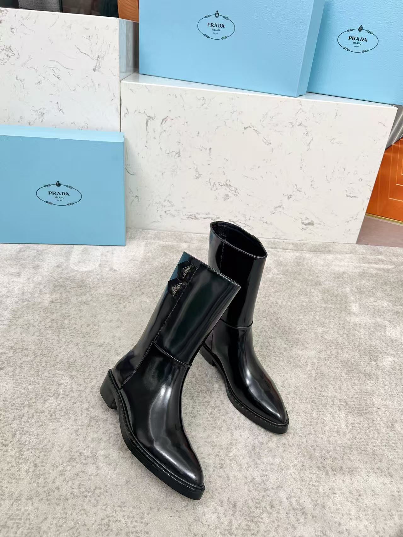 Black patent leather mid-calf boots